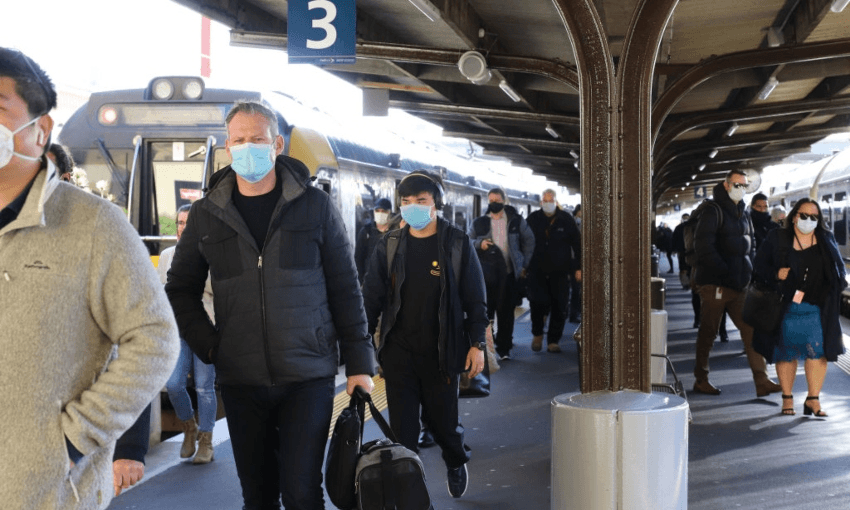 Commuters wearing face masks at Wellington’s train station (Getty Images)  
