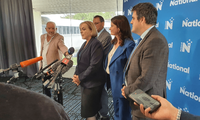 Judith Collins speaking to media, flanked by some of her senior MPs, in Ellerslie (Alex Braae)