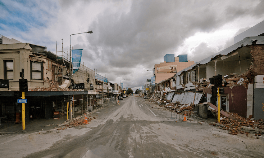 Rubble and damaged buildings lining a deserted Colombo St in the days following the February 22, 2011 quake (Photo: Logan McMillan/AFP via Getty Images) 
