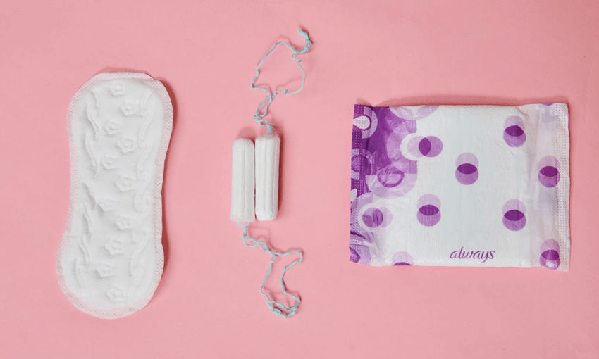 Tampons, a panty liner and a sanitary napkin from different manufacturers are on one table.