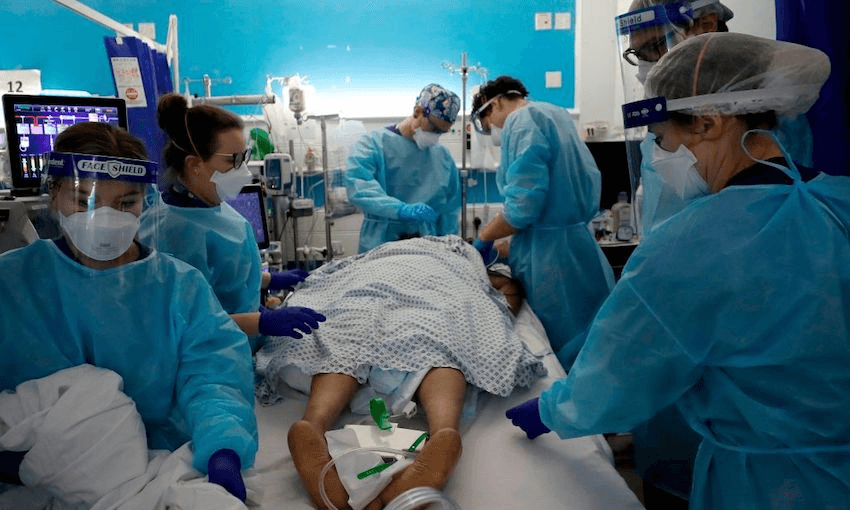 Critical Care staff look after a Covid-19 patient  at a London Hospital on January 27, 2021.  (Photo: KIRSTY WIGGLESWORTH/POOL/AFP via Getty Images) 
