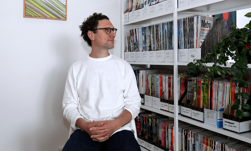 Metro editor Henry Oliver with the Metro archives (Photo: Edith Amituanai/ Metro magazine/supplied) 
