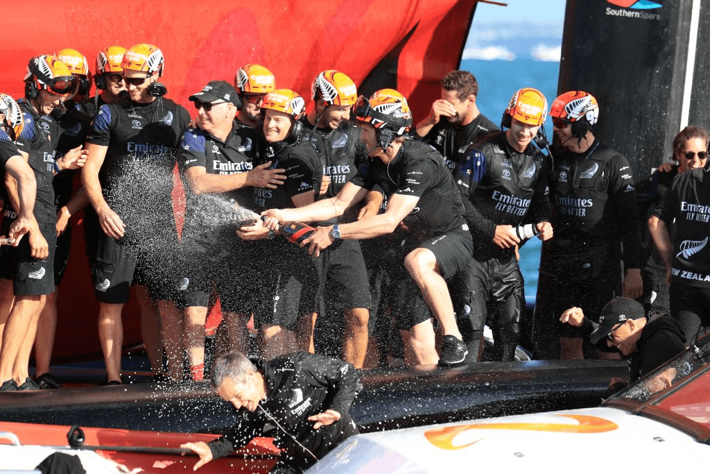 Emirates Team New Zealand crew celebrate victory against Luna Rossa Prada Pirelli in race 10 to win the 36th America’s Cup in Auckland (Photo by GILLES MARTIN-RAGET/AFP via Getty Images) 
