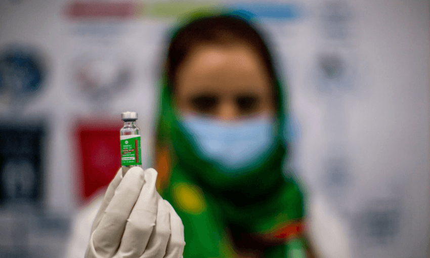 A nurse holds up a vial of vaccine at a hospital in Srinagar. India has administered more than 55 million shots of Covid-19 vaccine so far. (Photo: Yawar Nazir/Getty Images) 
