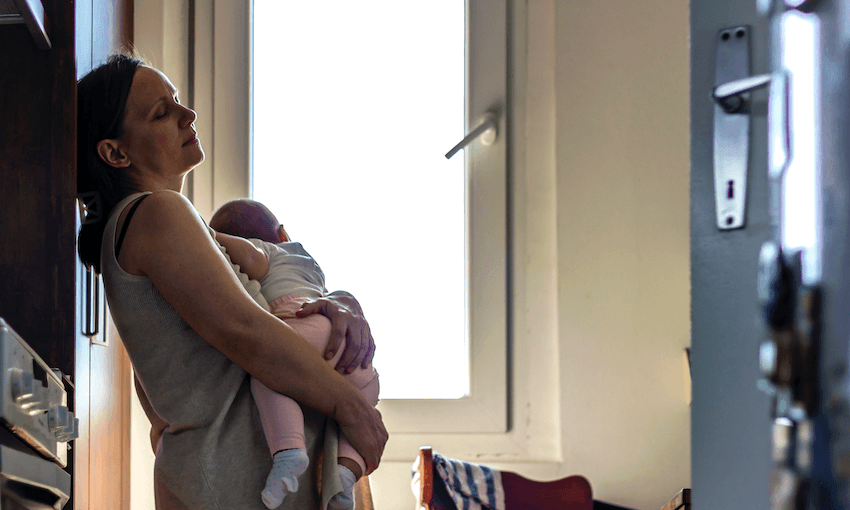 tired/worried mother holding baby