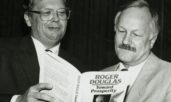 David Lange and Roger Douglas peruse a copy of Douglas’s book Towards Prosperity in 1987. (Photo: John Nicholson for Evening Post via National Library) 
