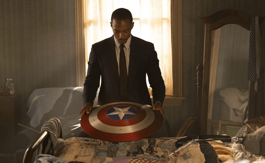 Sam Wilson (Anthony Mackie) looks over the famous shield of the departed Captain America. (Photo: Disney)