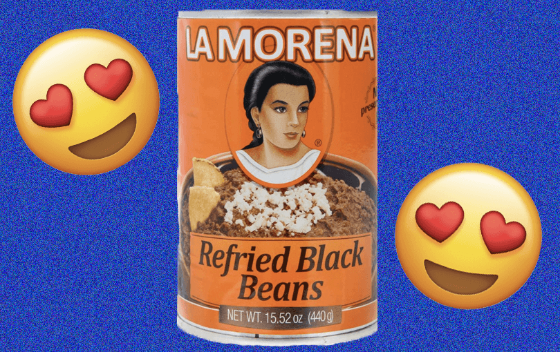 A can of La Morena refried beans with two heart eyes emojis on either side.