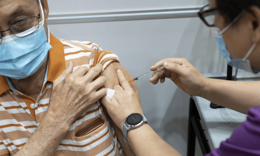 A senior citizen getting the Pfizer-BioNTech Covid-19 vaccine in Singapore, March 8, 2021 (Photo: Wei Leng Tay/Bloomberg via Getty Images) 
