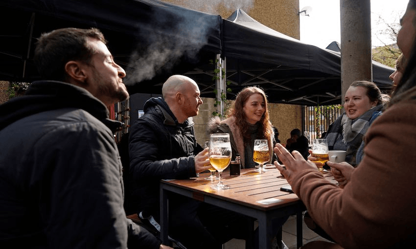 A group of friends enjoy  post-lockdown life at the Half Moon pub in East London on April 12 (Photo: NIKLAS HALLE’N/AFP via Getty Images) 
