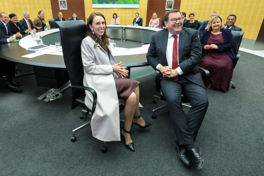 Prime Minister Jacinda Ardern and Deputy Prime Minister Grant Robertson look on during the first cabinet meeting since the election (Photo by Hagen Hopkins/Getty Images) 
