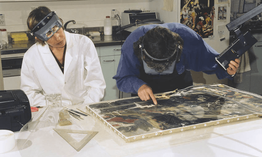 Sarah Hillary and Nel Rol inspecting James Tissot’s Still on top during the 
restoration process in 1999 (Photo: Supplied) 
