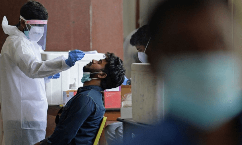 A traveller getting a Covid test at an airport in Chennai, India (Getty Images) 
