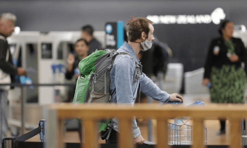 A traveller at Auckland Airport (Radio NZ, Simon Rogers)  

