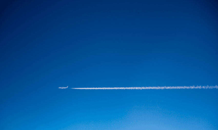 Blue sky, a plane leaving white vapour trails