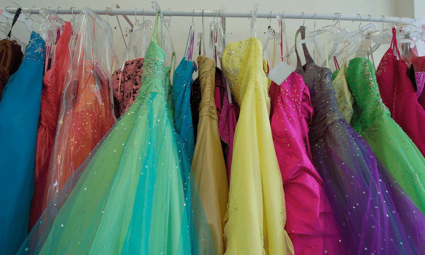 a rack of prom dresses
