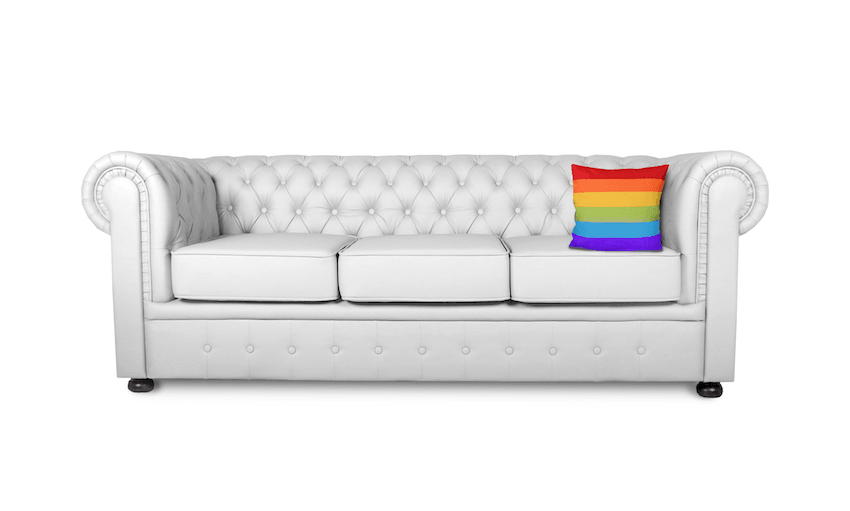 white sofa with rainbow coloured cushion