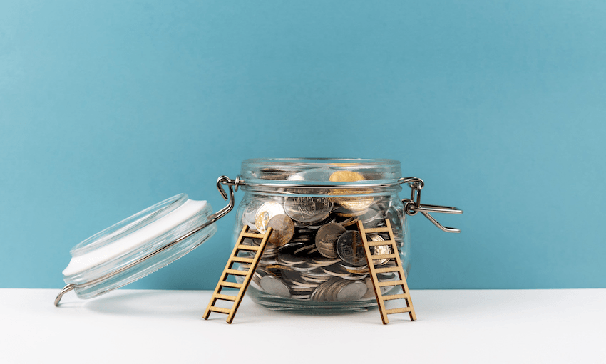 Ladders lent against jar of coins