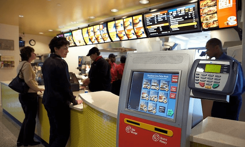 Fast food restaurant touch screens – like this prototype version at a McDonald’s in 2005 – is a kind of workplace automation many of us regularly interact with  (Photo: Ralf-Finn Hestoft/Corbis via Getty Images) 
