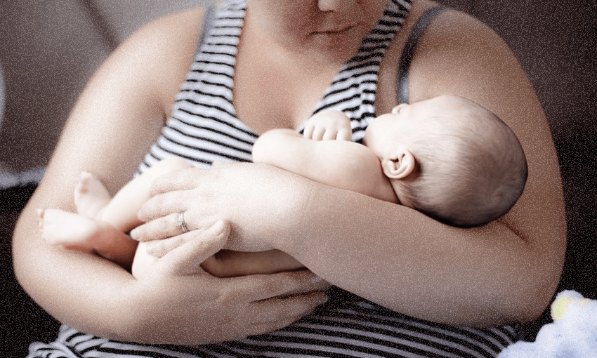 A mum holding her baby.