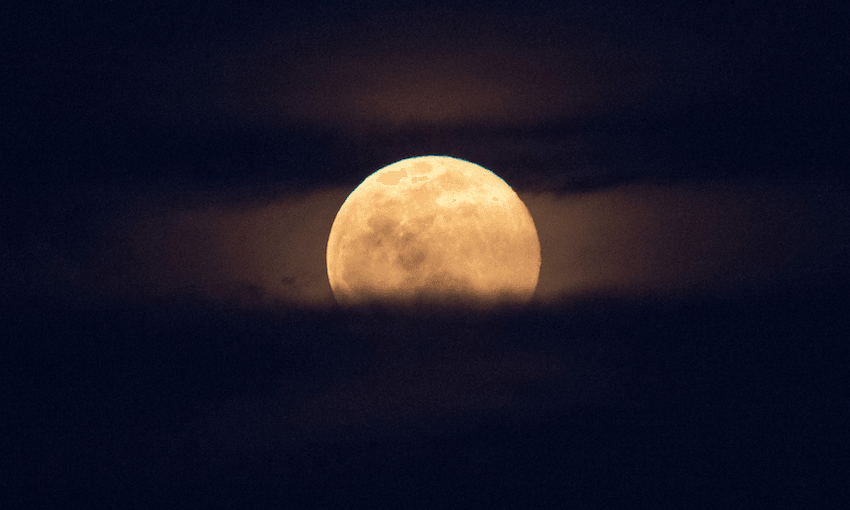 a dark and mysterious sky with a slightly pink tinged (but not really) moon