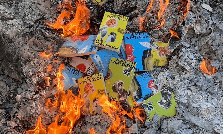 Books by Jeanette Winterson are visible in a bonfire