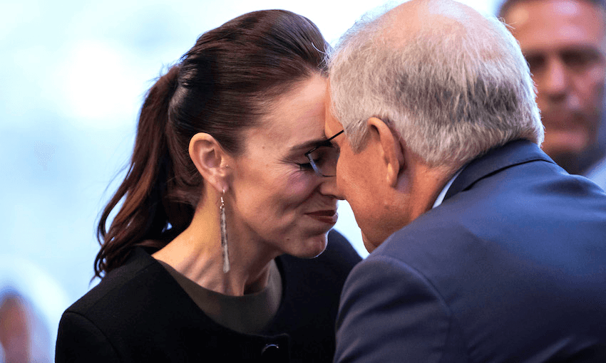 Jacinda Ardern and Scott Morrison hongi. We can see that Ardern is smiling.