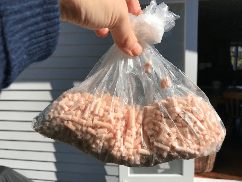 A baggy of pale-pink pellets
