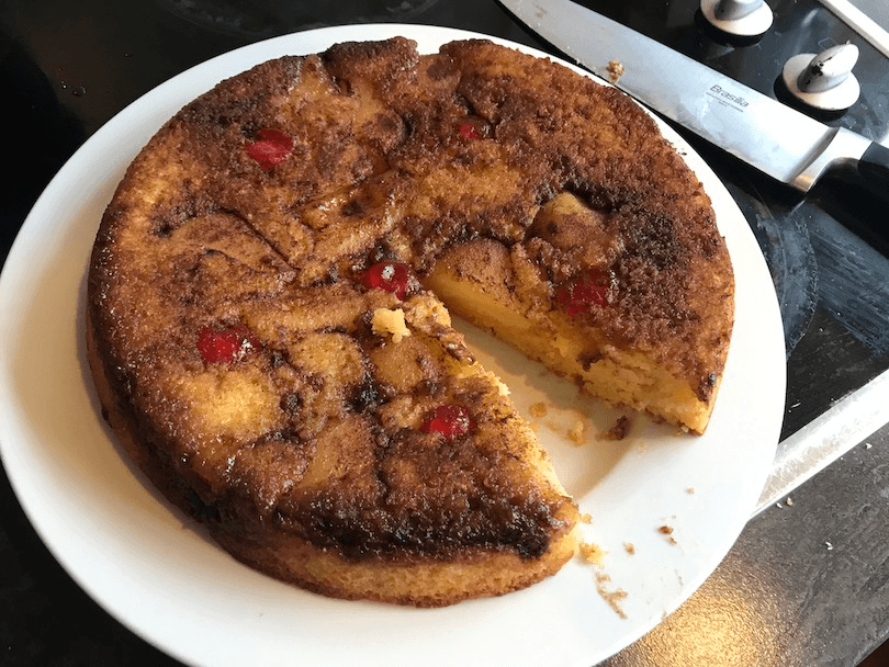 A cake on a plate, with a wedge cut out