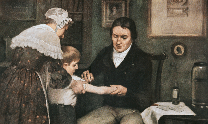Dr Edward Jenner performing his first vaccination against smallpox on James Phipps, a boy of eight. May 14, 1796, oil on canvas by Ernest Board (Image: Getty) 
