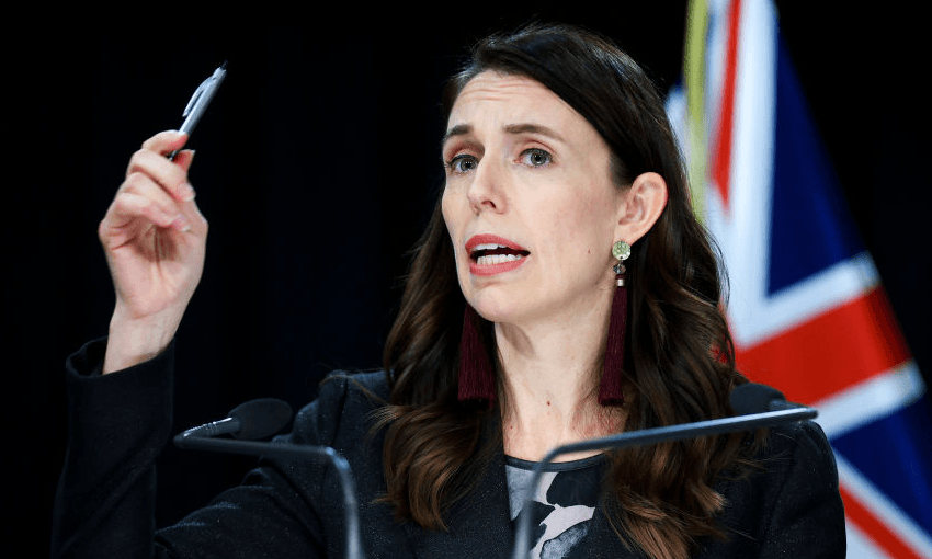 Jacinda Ardern addresses media during a press conference in June, when Wellington was at alert level two. (Photo by Hagen Hopkins/Getty Images) 
