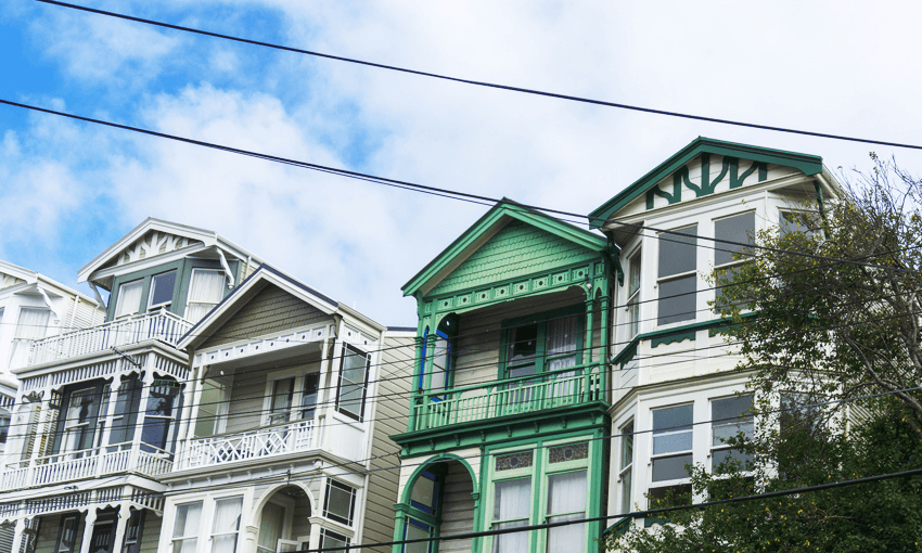 three houses with sky behind them. they are pretty victorian terraces but looking at them you feel almost certain that they are cold, expensive, and damp. it's just a vibe
