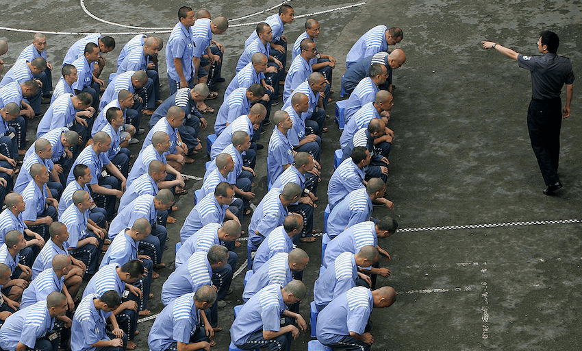 Inmates at Chongqing Prison in China, May 2005.  (Photo by China Photos/Getty Images) 
