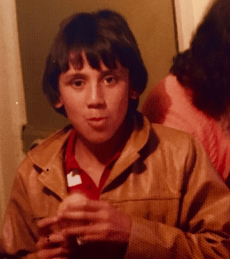 Old family photo of a boy aged approx 12? in an awesome tan leather jacket. 