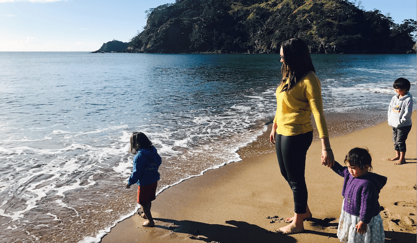 Dr Chanel Phillips with her nephews and niece at Pataua Beach (Image: Supplied) 
