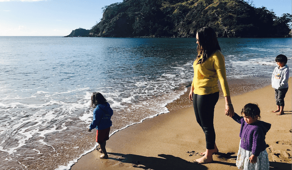 Dr Chanel Phillips with her nephews and niece at Pataua Beach (Image: Supplied) 
