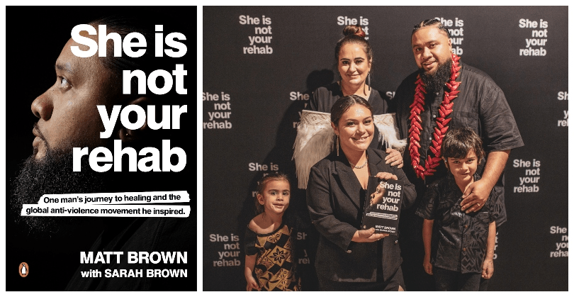 A family of five stand close together for a photo, three children in the front, one holding a book. Backdrop is black and printed with She Is Not Your Rehab.