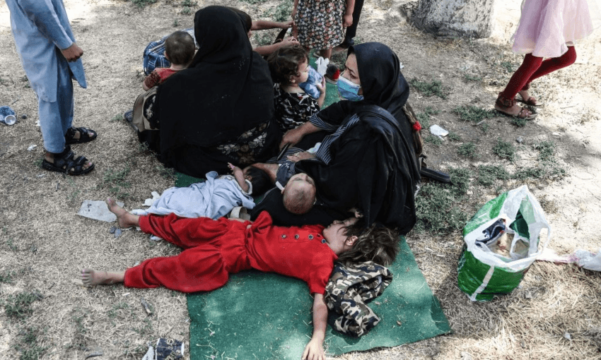 Internally displaced Afghan families wait at the Shahr-e-Naw Park in Kabul. Photo by WAKIL KOHSAR / AFP 
