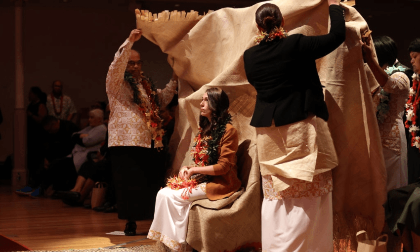 Jacinda Ardern with the ie tōga, part of the ifoga process, the Samoan tradition of asking for forgiveness. Photo by Fiona Goodall/Getty Images 
