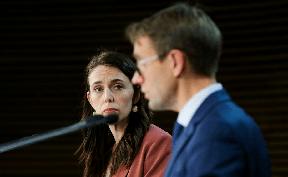 Ashley Bloomfield and Jacinda Ardern at this evening’s press conference, at which it was announced all of NZ moves to Level 4. Photo by Hagen Hopkins/Getty Images 
