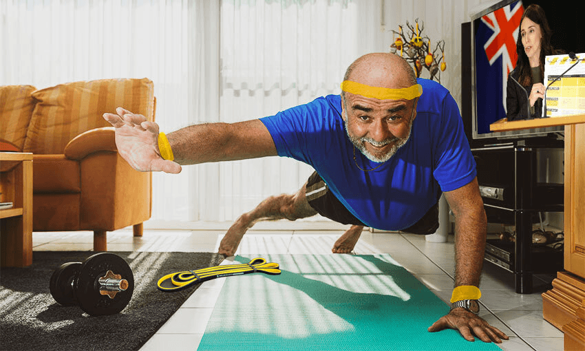 man in a sweaty headban stretching on a yoga mat