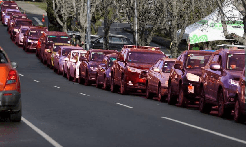 People wait to be tested at a Covid-19 testing station in College Rd, Northcote on August 18, 2021 in Auckland, New Zealand. (Photo by Fiona Goodall/Getty Images)