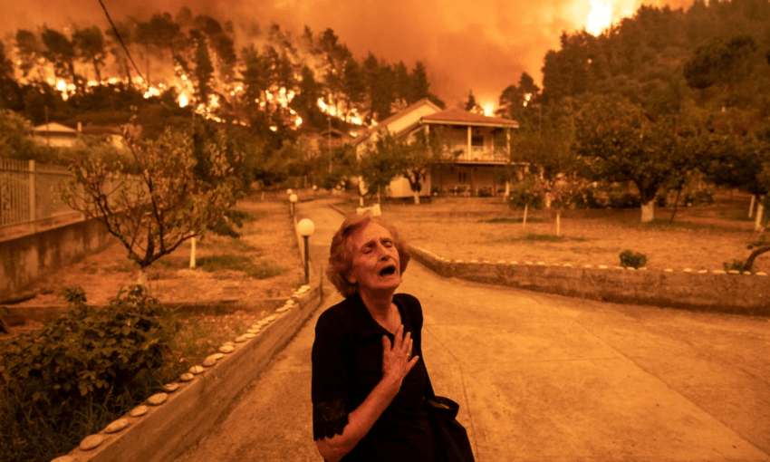 An evacuee on the Greek island of Evia, which is currently on fire in an event made worse by climate change (Getty Images)  
