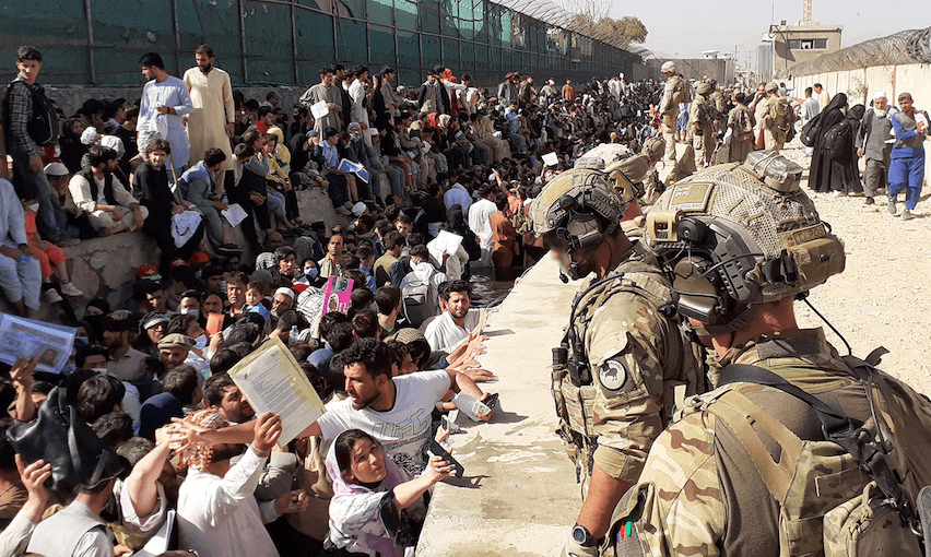 NZDF personnel at the perimeter of Hamid Karzai International Airport, following the fall of Kabul in August 2021 (Photo: NZ Defence Force)  
