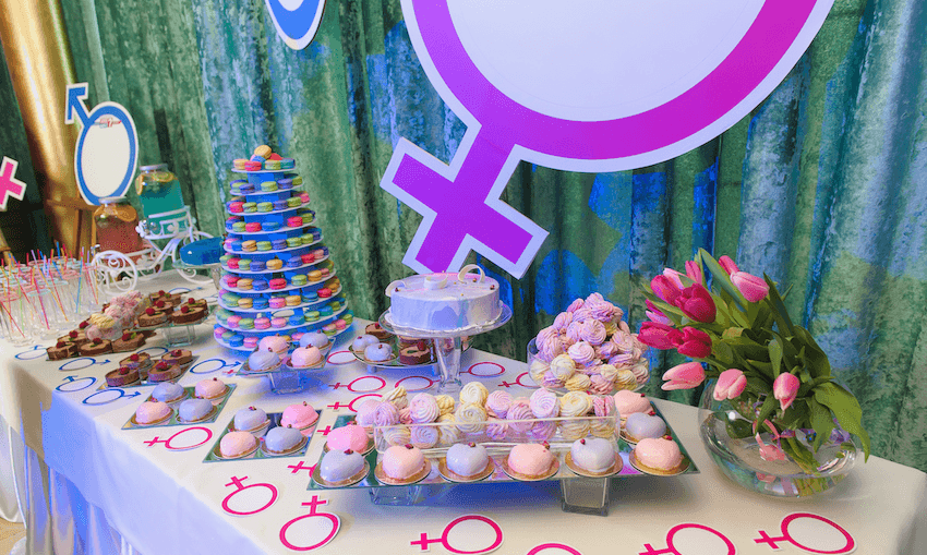 Cakes on display at a gender reveal party