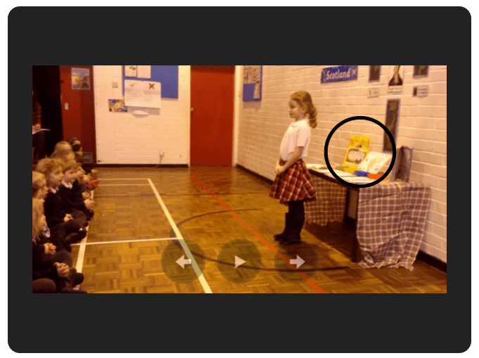 Screenshot of a video where a girl is presenting a project on Hairy Maclary