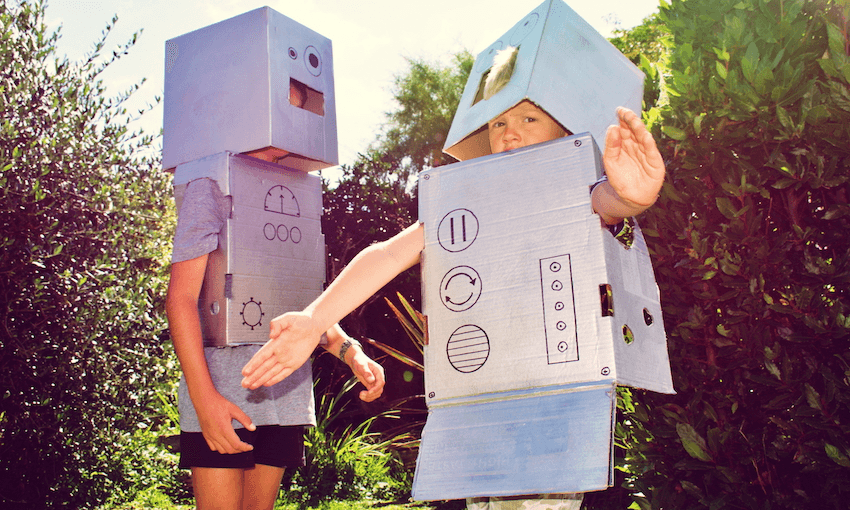 Two children dressed as cardboard-box robots