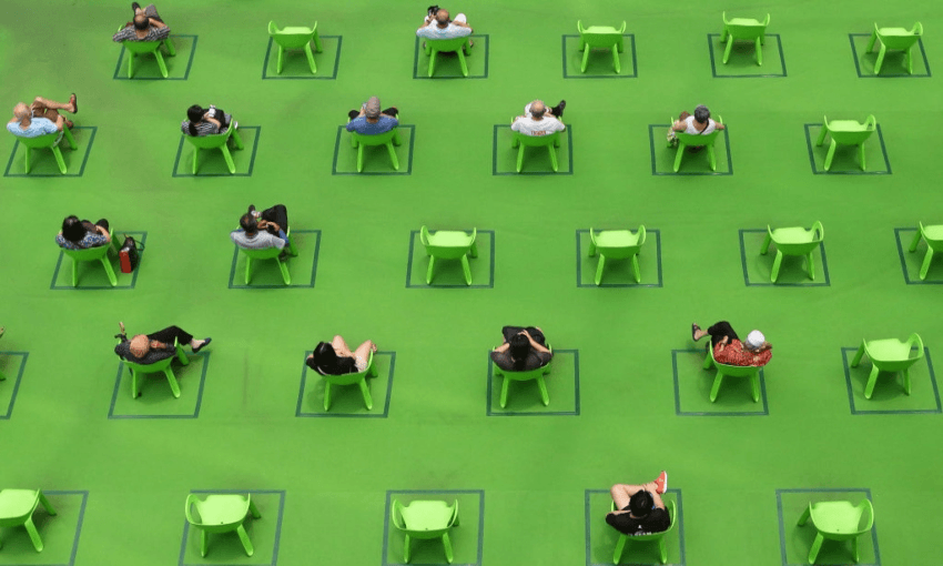 Socially distanced seating in Singapore, in March 2021. Photo by Suhaimi Abdullah/NurPhoto via Getty Images 
