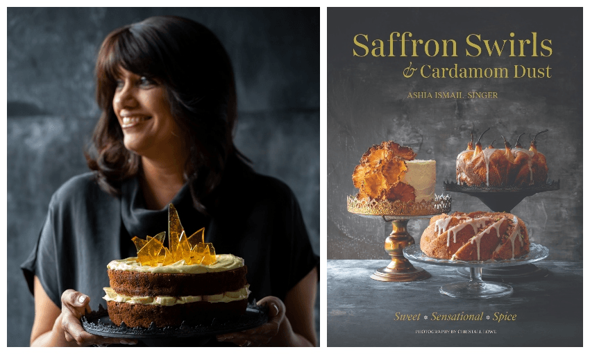 Photograph of a woman in a dark dress, photographed against a dark wall, holding a gorgeous cake with toffee shards on top. Next to her, a book cover featuring similarly gorgeous cakes