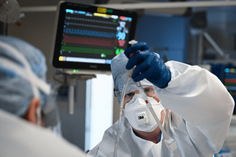 Staff at University Hospital Monklands in Scotland monitor a Covid-positive patient on the ICU ward on February 5, 2021 (Photo: Jeff J Mitchell/Getty Images) 
